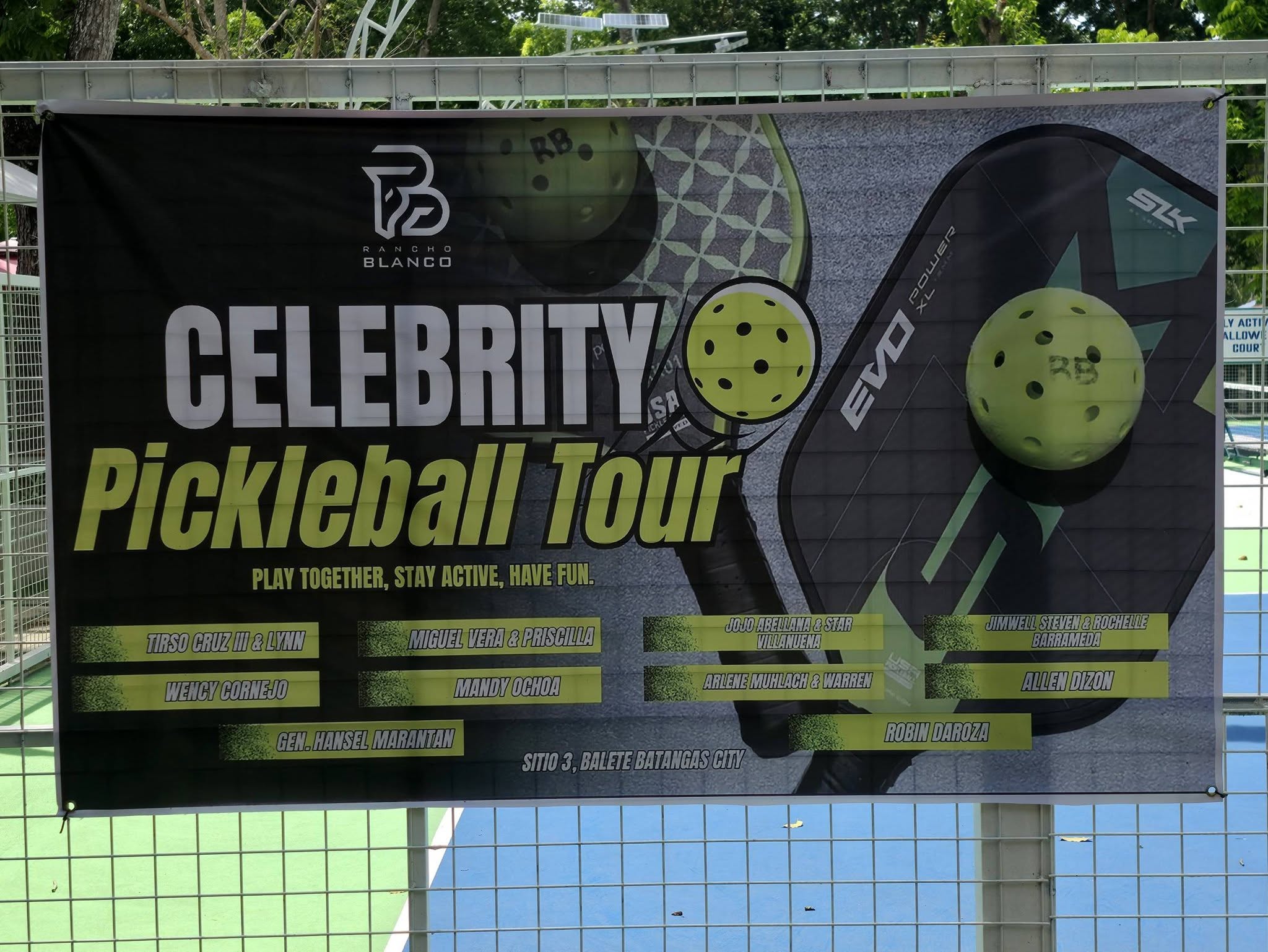 The Celebrity Pickleball Tour banner at the Rancho Blanco courts