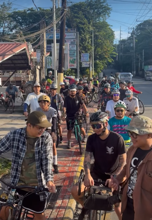 Cyclists gathered at the roadside before the Breakfast Ride sa Umaga